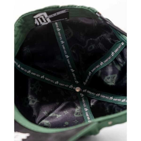 Detailed Interior Shot of Green Cap Lining Close-up of the green cap’s interior highlighting custom Dandy Hats lining and stitching details.