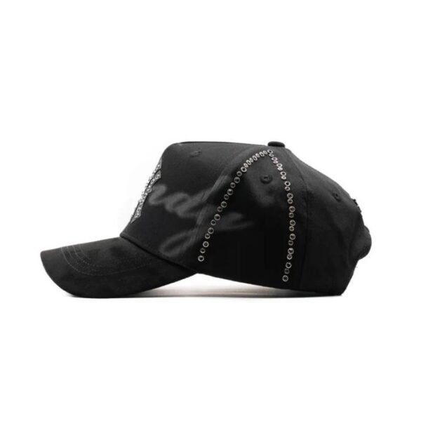 oNYx Cap Side Profile – What Would Dandy Do Side view of the oNYx cap showing grommet detailing and embroidered “Dandy” text shadow.